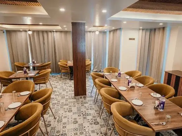 Restaurant with mustard chairs and tiled floor