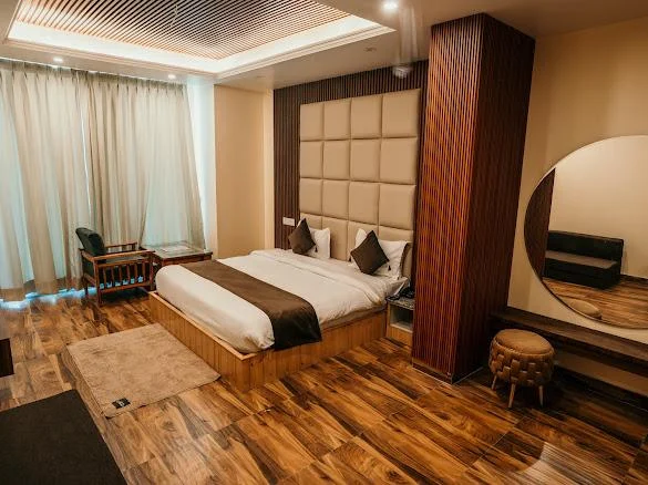 Snow Castle room with padded headboard and wooden floor
